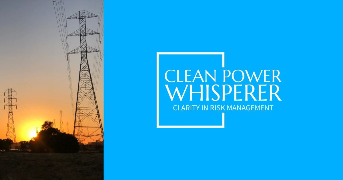 A high-voltage transmission tower against a low orange sunset.
